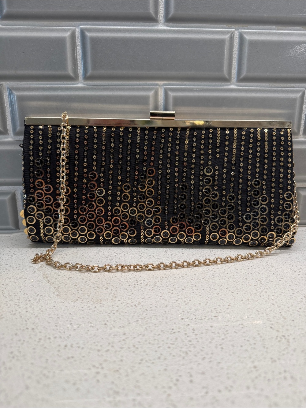 Sondra Roberts Black and Gold sequined clutch with chain strap